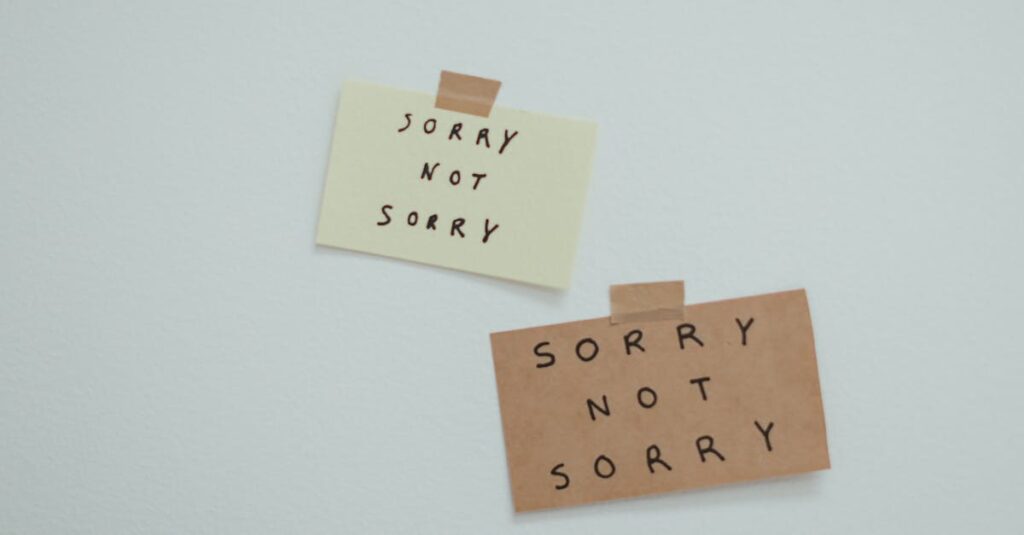Two notes reading 'Sorry Not Sorry' taped to a wall, conveying a playful message.
